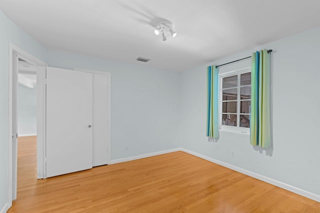 430 N Ocean Breeze, Lake Worth Beach, FL 33460 - unfurnished bedroom featuring light wood-style flooring and baseboards