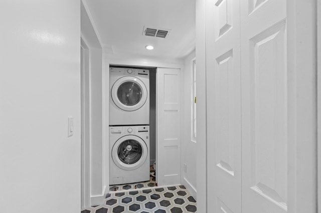 430 N Ocean Breeze, Lake Worth Beach, FL 33460 - washroom featuring stacked washing machine and dryer, recessed lighting, and tile patterned flooring
