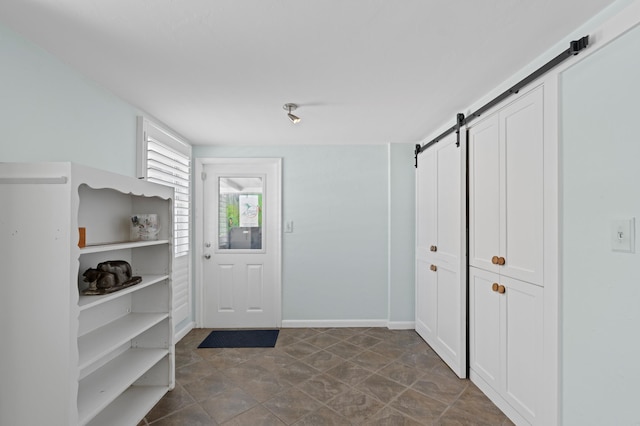 430 N Ocean Breeze, Lake Worth Beach, FL 33460 - entryway featuring a barn door and baseboards