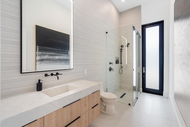 bathroom featuring walk in shower, tile patterned flooring, vanity, and toilet