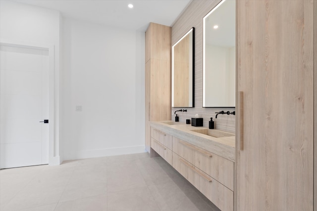 bathroom with vanity, decorative backsplash, and tile patterned floors