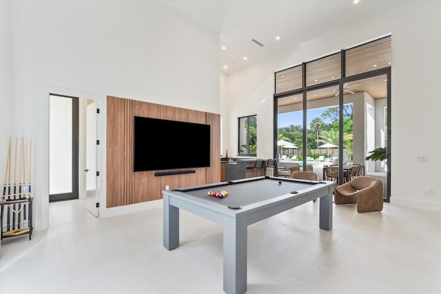 game room featuring a high ceiling and billiards