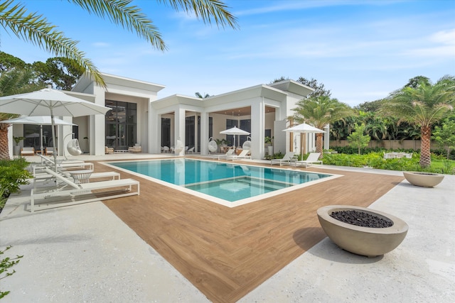 view of swimming pool with a patio