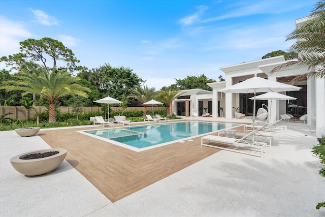 view of swimming pool with a patio