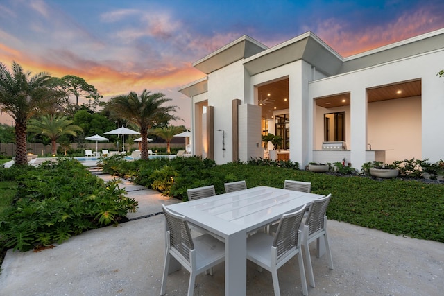 view of patio terrace at dusk