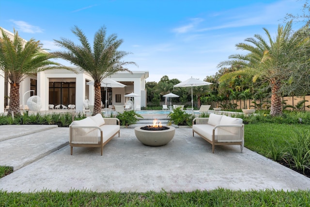 view of patio with an outdoor fire pit