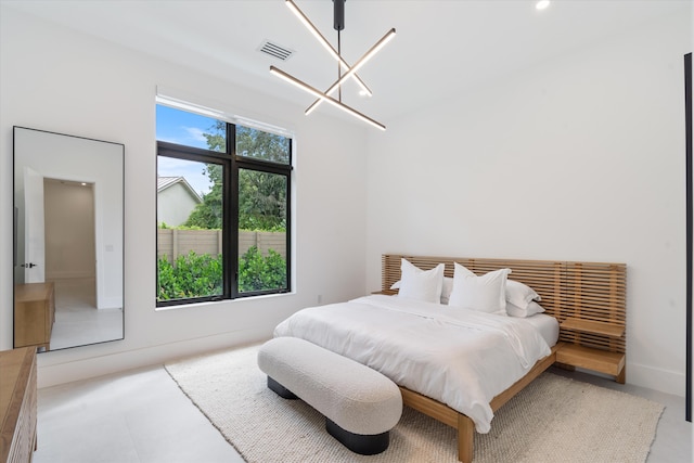 bedroom with an inviting chandelier