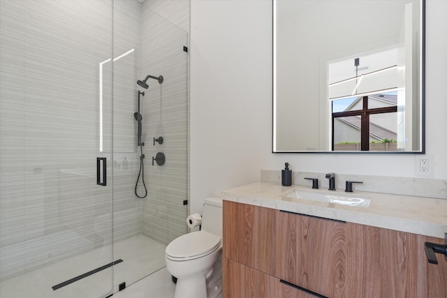 bathroom with tile patterned flooring, vanity, toilet, and a shower with shower door