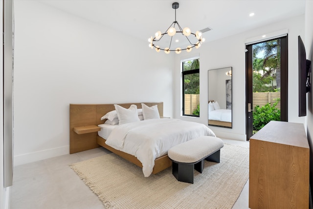 bedroom featuring access to exterior, light carpet, and an inviting chandelier