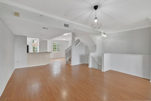 additional living space featuring visible vents, light wood finished floors, and baseboards