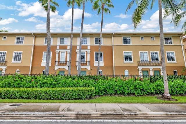 view of building exterior featuring fence