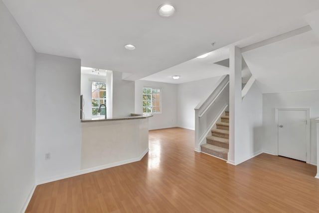 unfurnished living room featuring light hardwood / wood-style floors