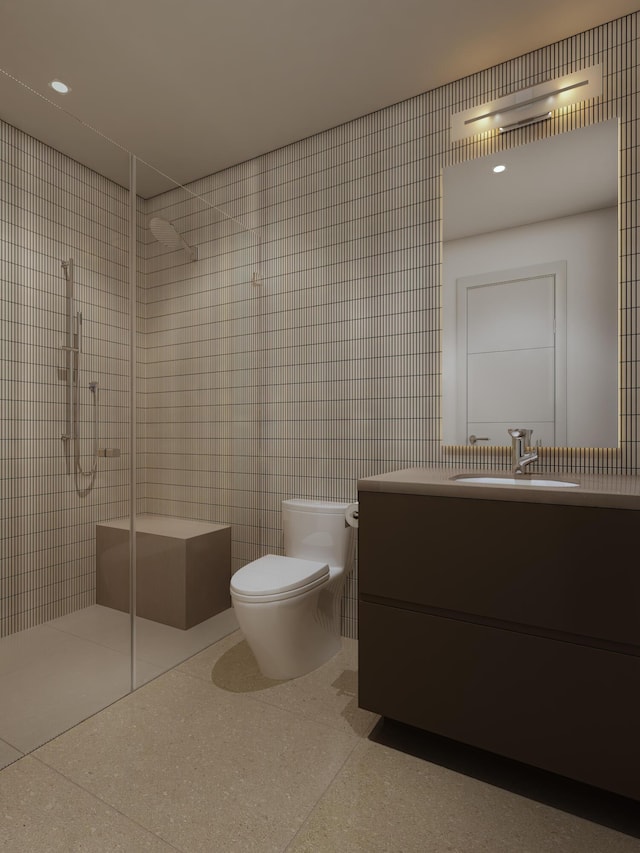 full bath with toilet, tile walls, vanity, and a stall shower