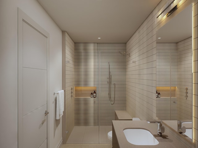 bathroom featuring a shower stall, toilet, vanity, and tile walls