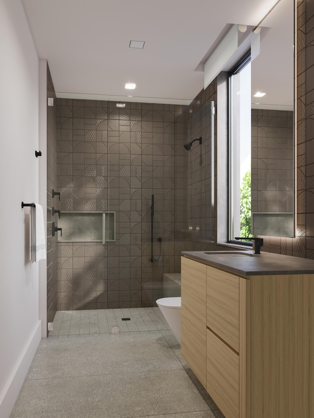 full bathroom featuring vanity, recessed lighting, and a tile shower