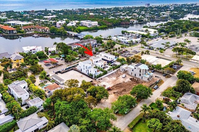 birds eye view of property featuring a water view and a residential view