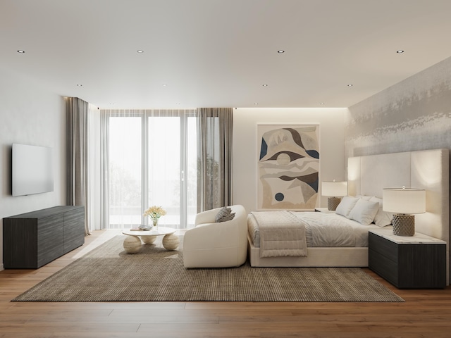 bedroom with light wood-type flooring and a wall of windows