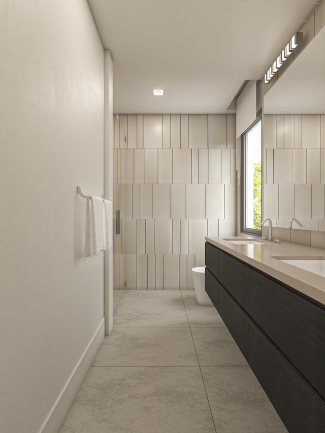 bathroom with concrete flooring, vanity, and toilet