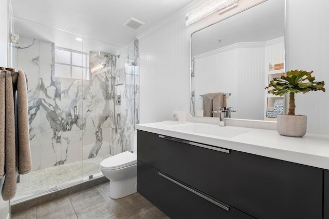 bathroom featuring vanity, toilet, and a shower with shower door