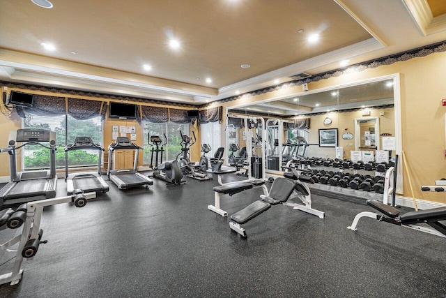 exercise room with a tray ceiling