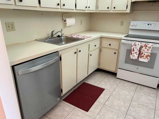 kitchen featuring white electric range oven, stainless steel dishwasher, sink, cream cabinets, and light tile patterned floors