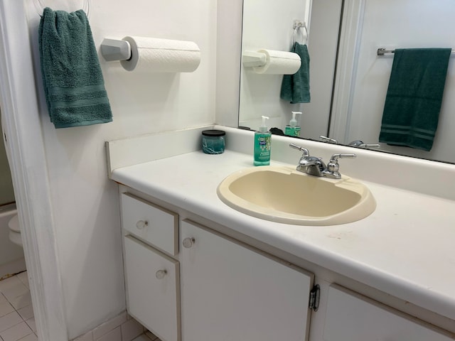 bathroom with tile patterned floors, vanity, and toilet