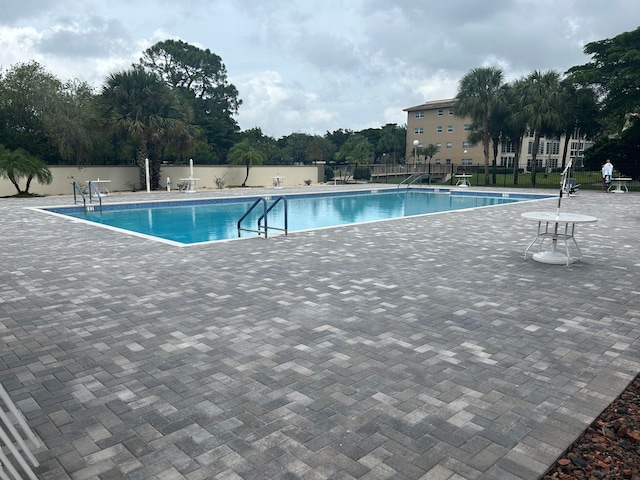 view of swimming pool featuring a patio area