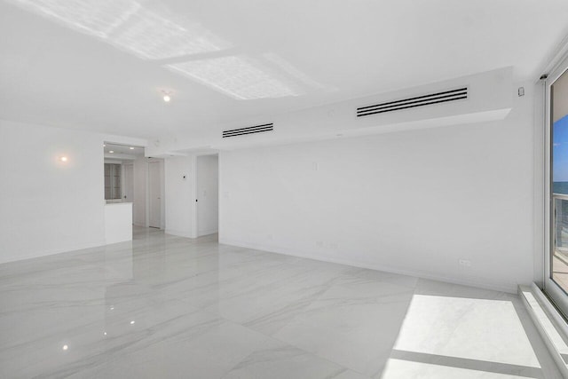 spare room featuring visible vents and marble finish floor