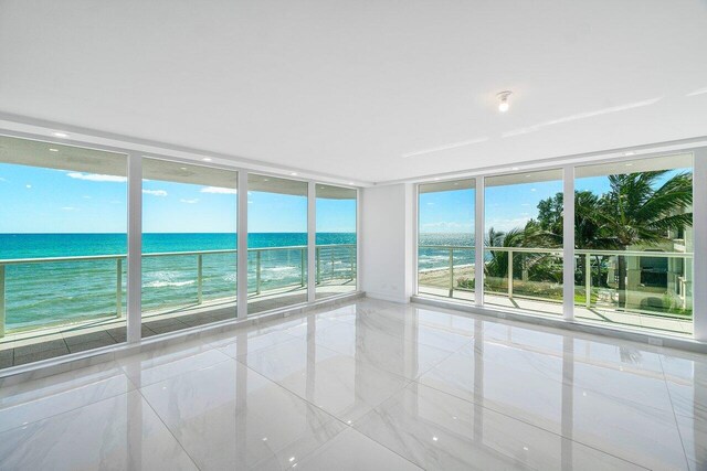 property view of water featuring a beach view