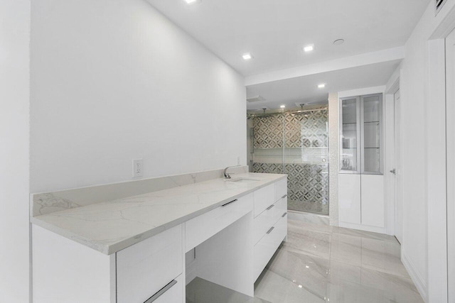 full bathroom featuring vanity, a shower stall, recessed lighting, and visible vents