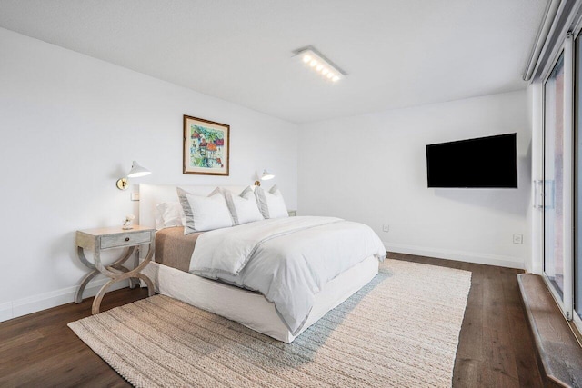 bedroom featuring dark hardwood / wood-style floors