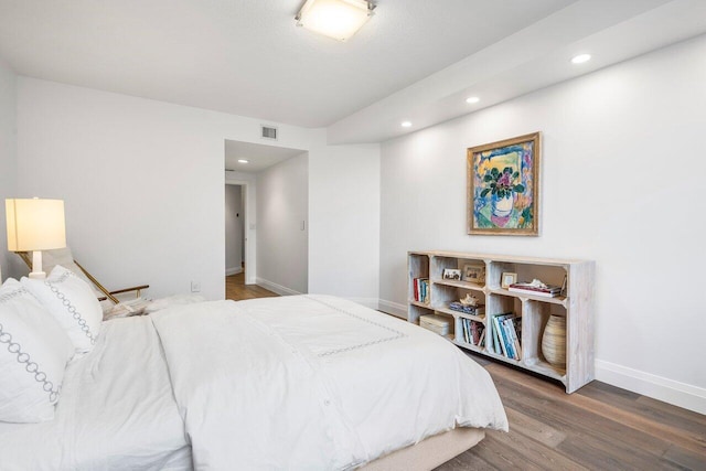 bedroom with hardwood / wood-style flooring