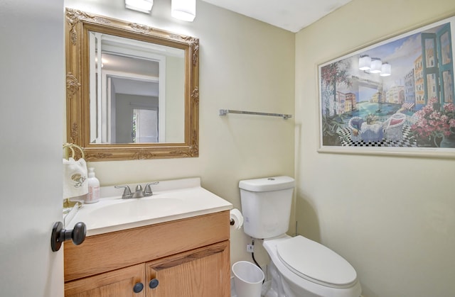 bathroom with toilet and vanity