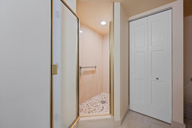 4101 N Ocean Blvd Unit D-308, Boca Raton, FL 33431 - bathroom with a stall shower, a closet, tile patterned flooring, and recessed lighting