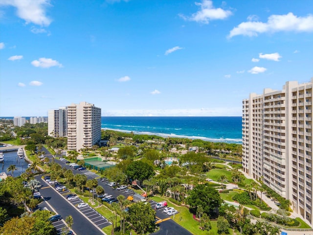 birds eye view of property featuring a view of the beach and a water view