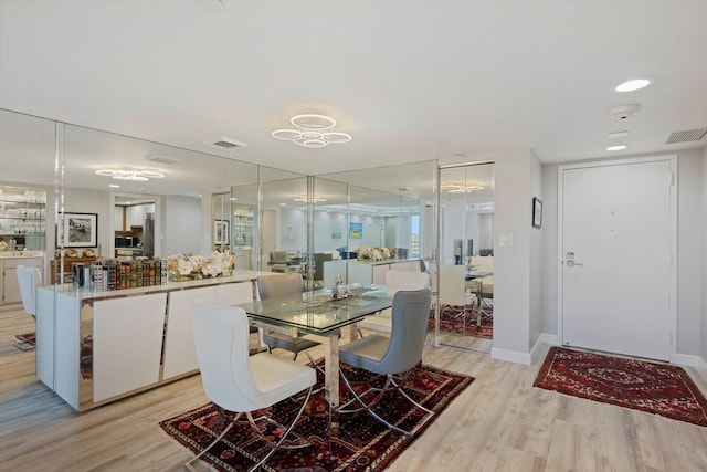 dining space featuring light hardwood / wood-style floors