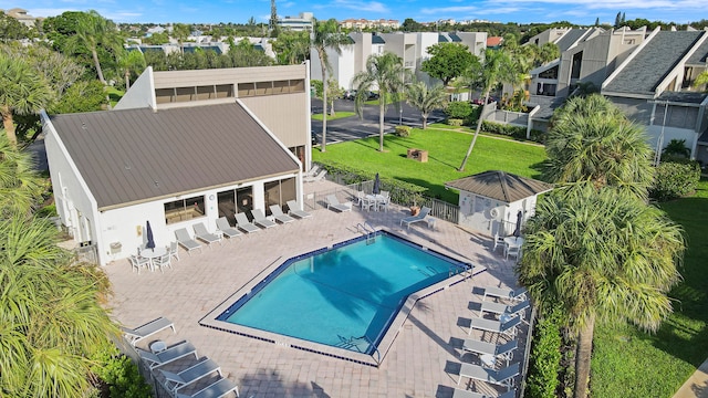 view of pool featuring a lawn and a patio area