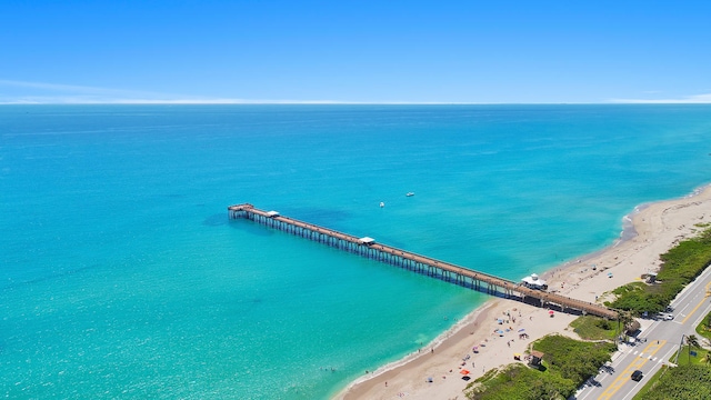 aerial view featuring a water view and a beach view