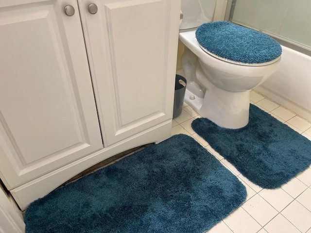 bathroom with tile patterned flooring and toilet