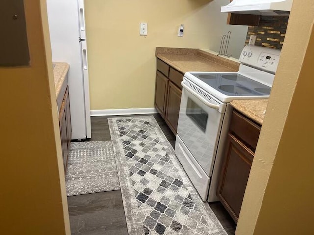 kitchen featuring white appliances, backsplash, range hood, and dark hardwood / wood-style flooring