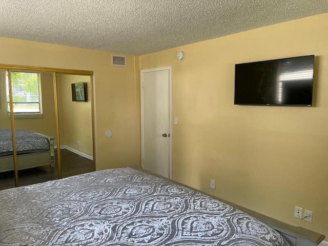 unfurnished bedroom with a closet and a textured ceiling