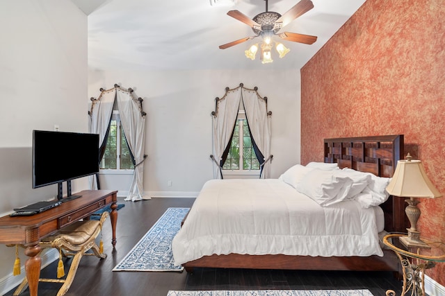 bedroom with ceiling fan and dark hardwood / wood-style floors