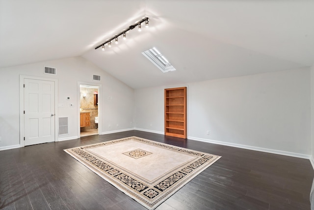 additional living space with dark wood-type flooring and vaulted ceiling