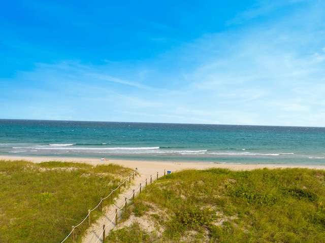 property view of water featuring a beach view