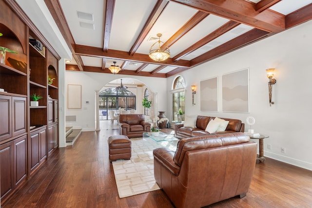 living room featuring beam ceiling and dark hardwood / wood-style flooring