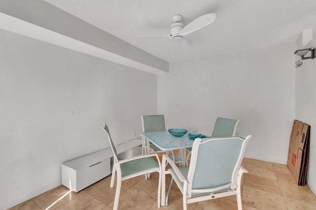 tiled dining space featuring ceiling fan