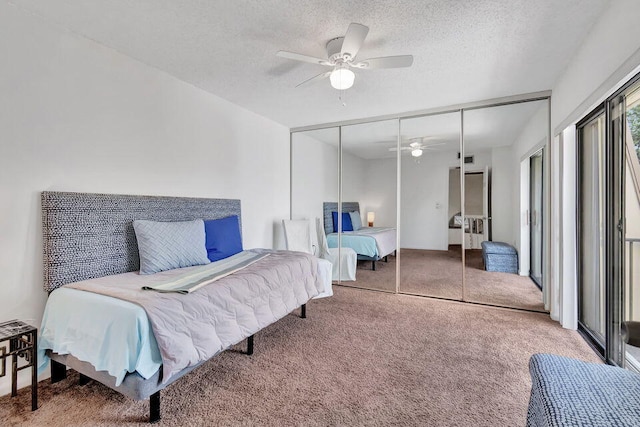 bedroom featuring carpet, a textured ceiling, a closet, and ceiling fan