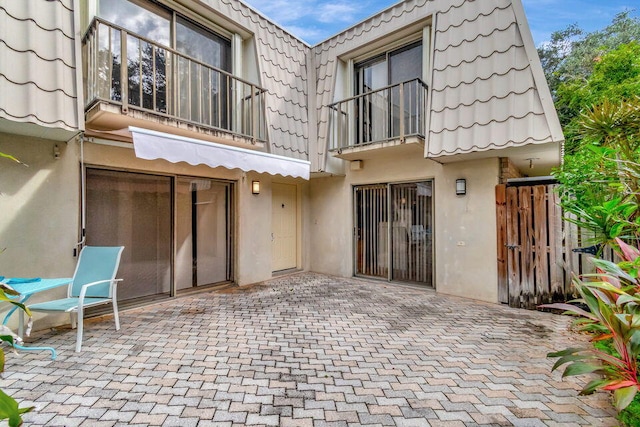 rear view of property with a patio area