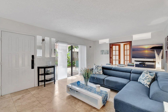 tiled living room featuring a textured ceiling