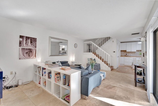 living room featuring light tile patterned flooring